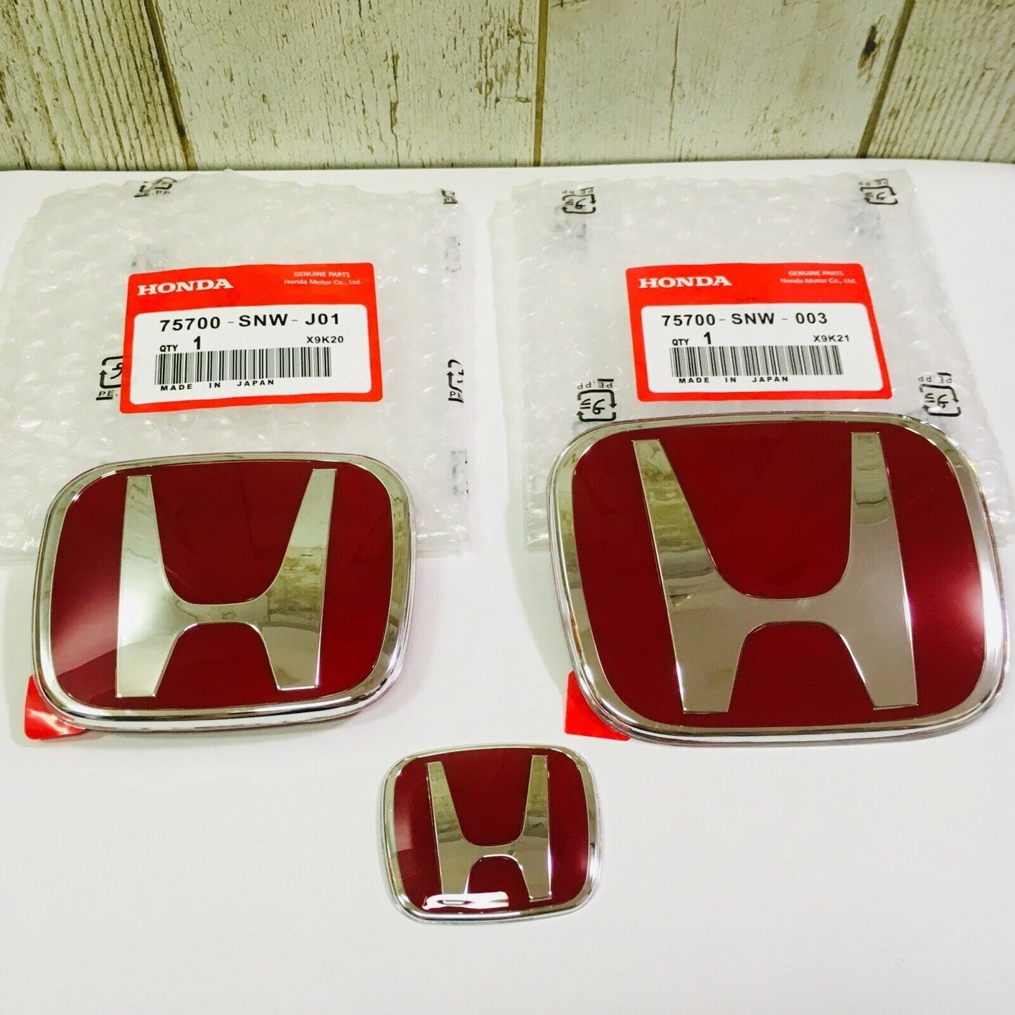 06-15 for Civic 4DR Sedan JDM, red H badges on front and rear steering wheels; 09-11 Fit (Jazz)