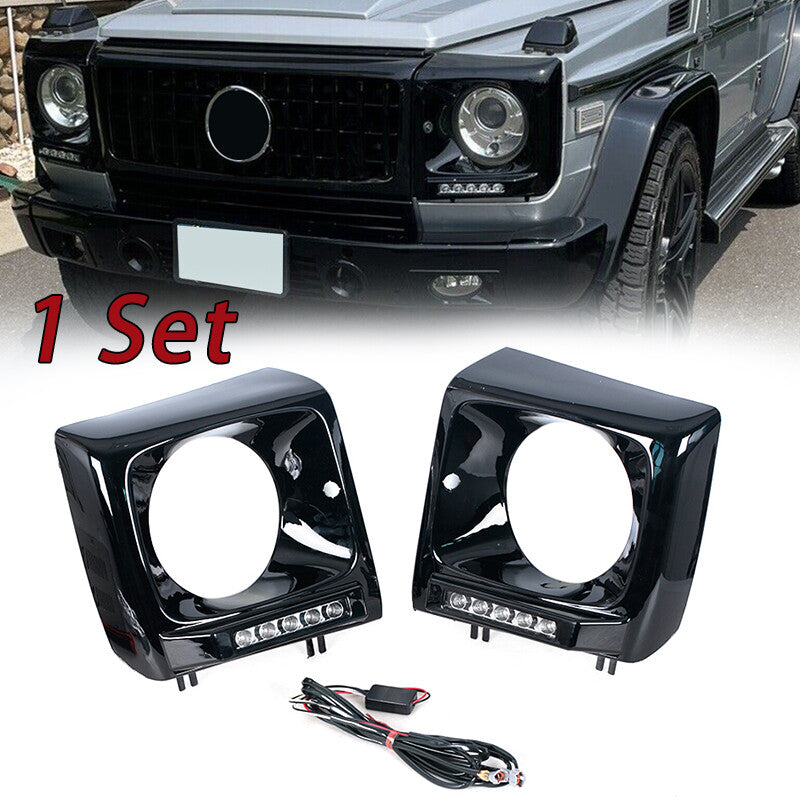 pair of black headlight bezels for the 1990-2018 for Mercedes W463 G63 Wagon G500 with LED DRLs.