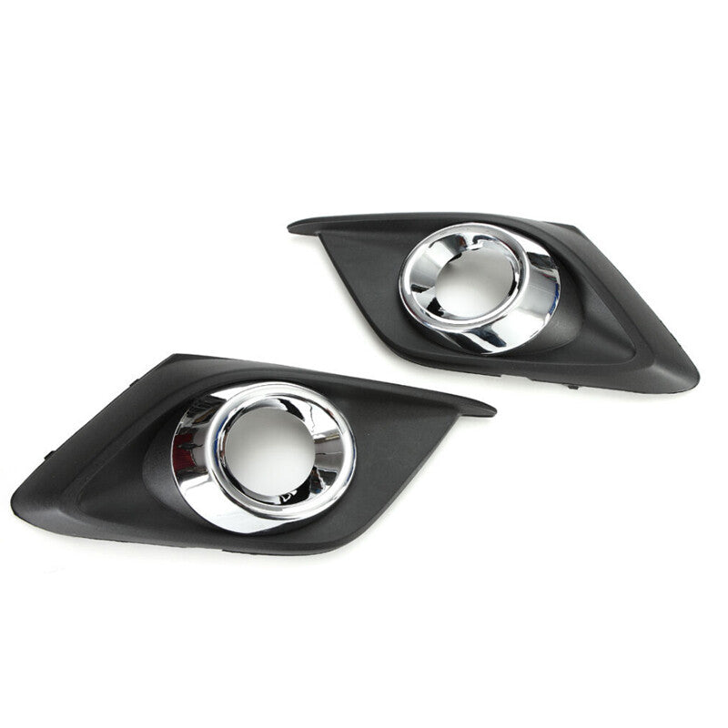 A pair of clear lens fog light kits with bezels, wires, and switches for Mazda 3 2014-2016.